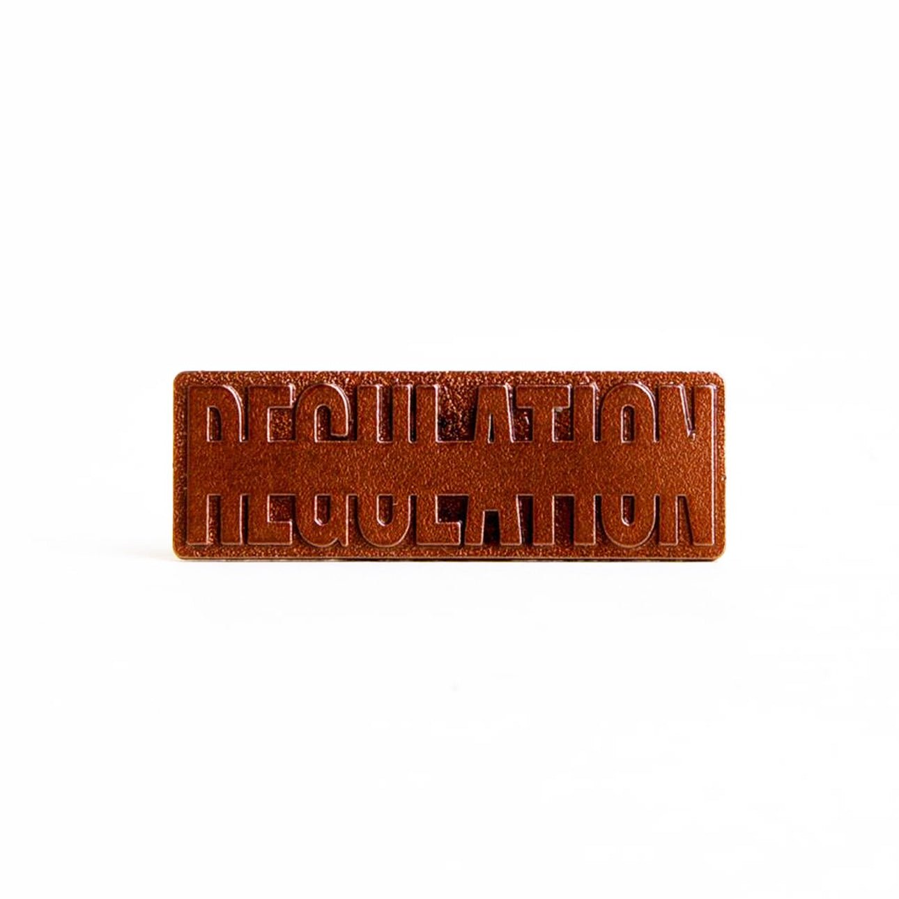 REGULATION Bronze Member Logo Pin from REGULATION.