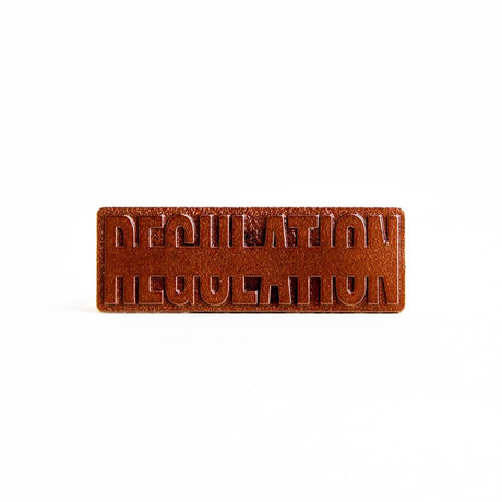 REGULATION Bronze Member Logo Pin from REGULATION.