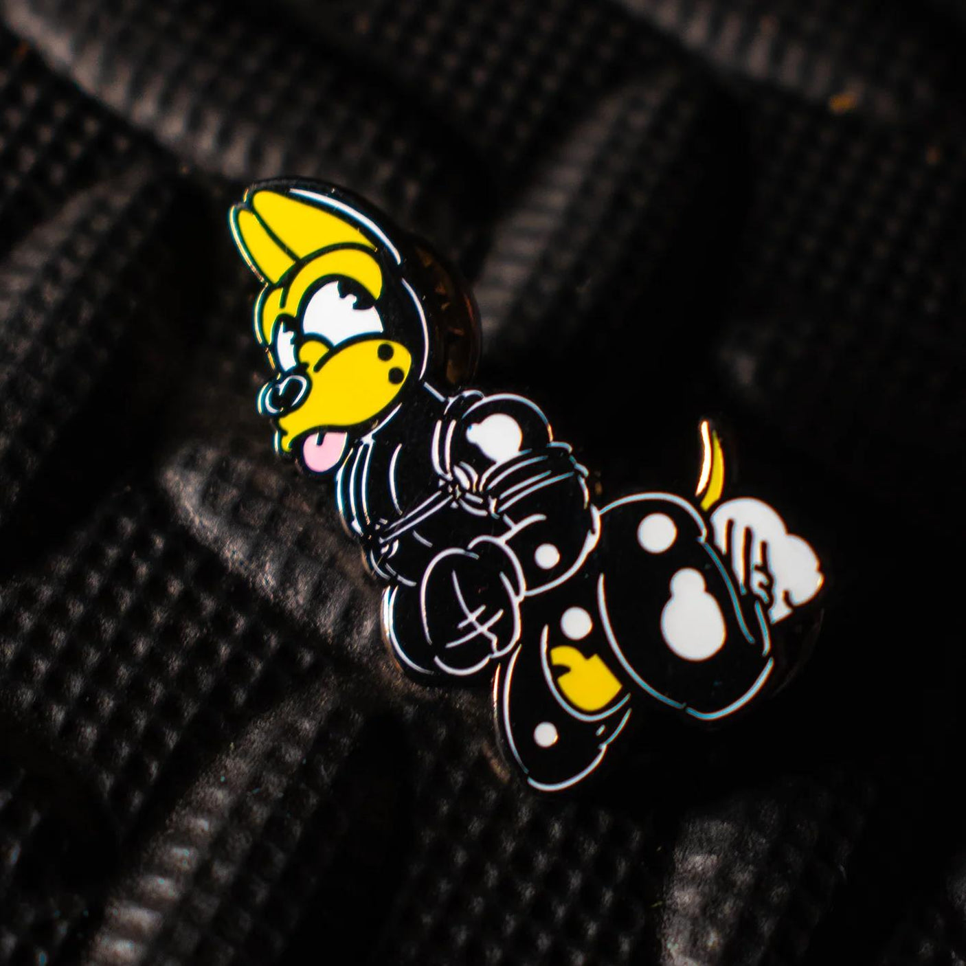 Rubber Dog Enamel Pin, Yellow from James Newland Illustration.